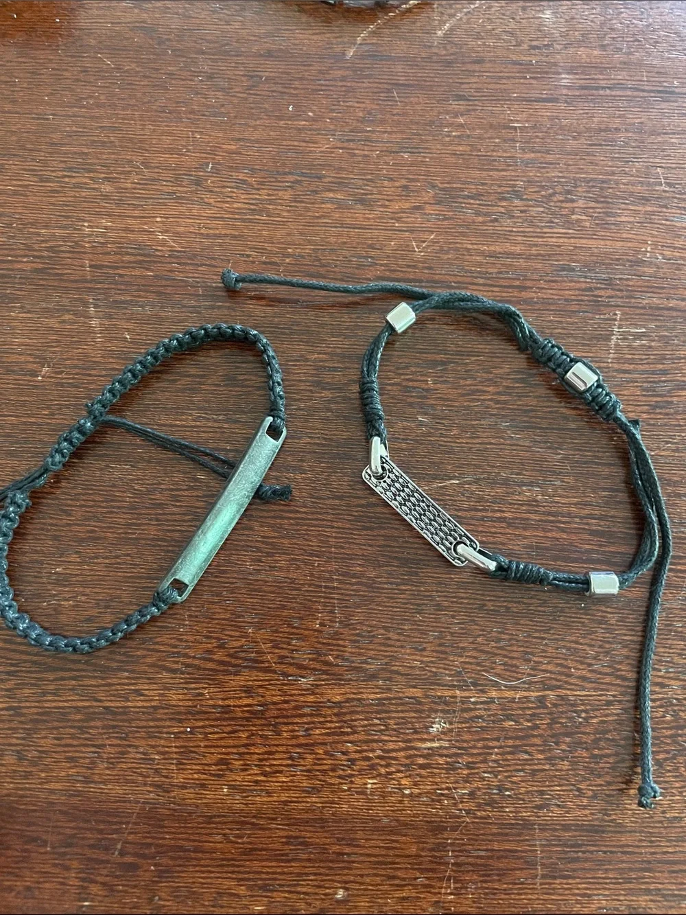 Men’s slider ID bracelets. Set of 2. Black. Braided. Stainless steel tags. NWOT